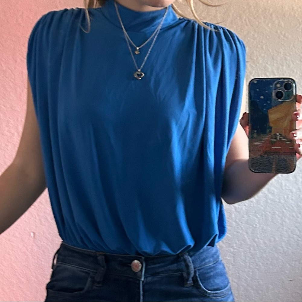 Open-back blue blouse